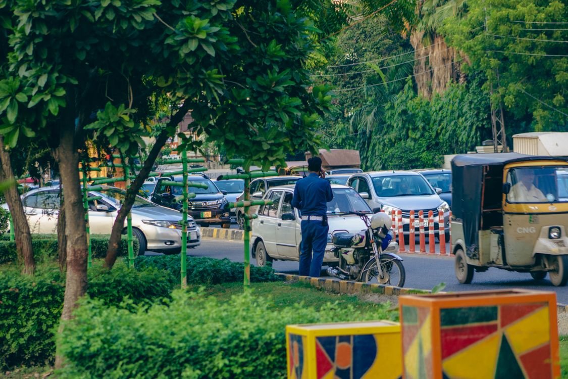 Punjab Police officer managing traffic on a street in Lahore, Pakistan