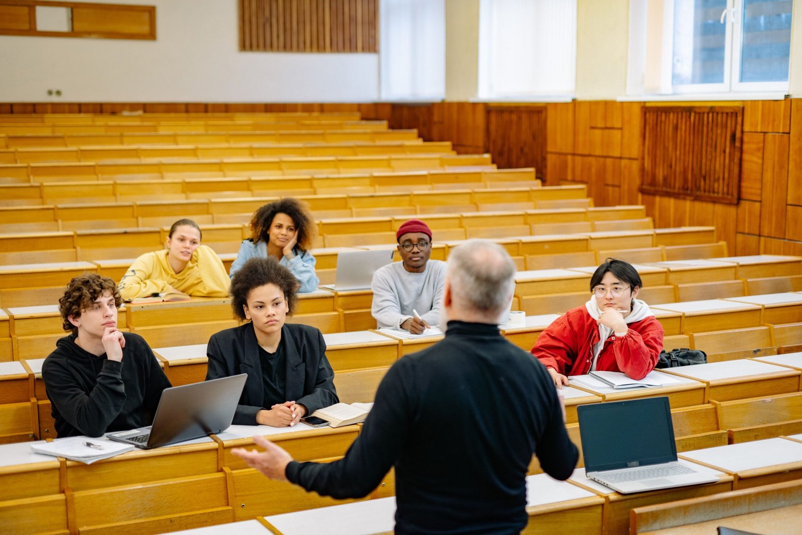 Professor teaching students in a university lecture hall in Pakistan