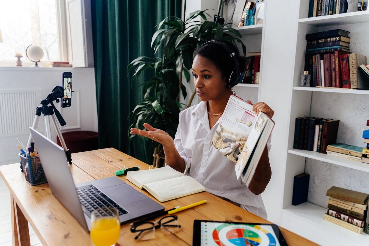 Online teaching jobs in Pakistan - woman teaching students online from home with laptop